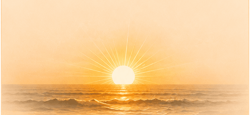 The sun setting over a calm ocean.